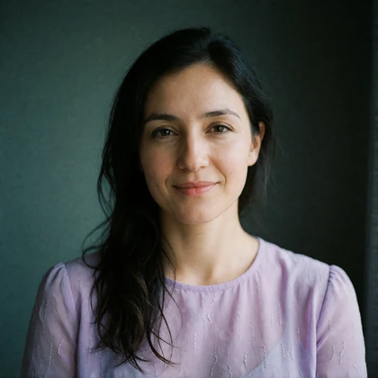 Portrait of a Tajik woman in her thirties in a lilac blouse, a verified member of the Tajik Dating community