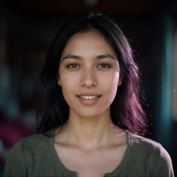 Portrait of a Nepali woman in her late twenties in an olive top, a verified member of the Nepali Dating community