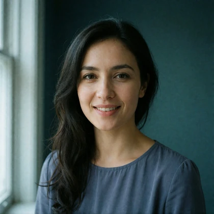 Portrait of an Uzbek woman in her thirties in a slate-blue blouse, a member of the Uzbek Dating community