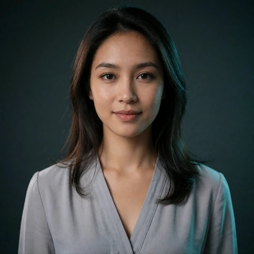 Portrait of an Indonesian woman in a soft grey blouse, a verified member of the Indonesian Dating community