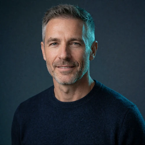 Portrait of a Western man in his early fifties in a navy sweater, a member of the Thai Dating community