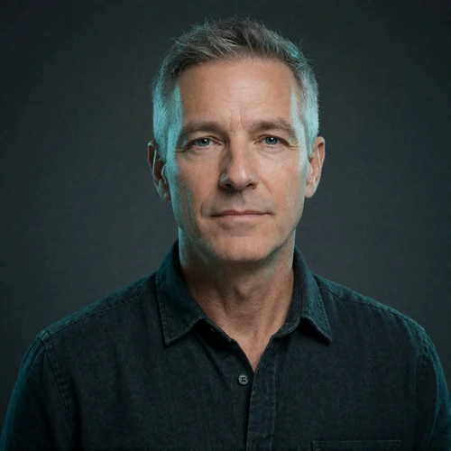 Portrait of a Western man in his mid-fifties with grey hair, a verified member of the Indian Dating community